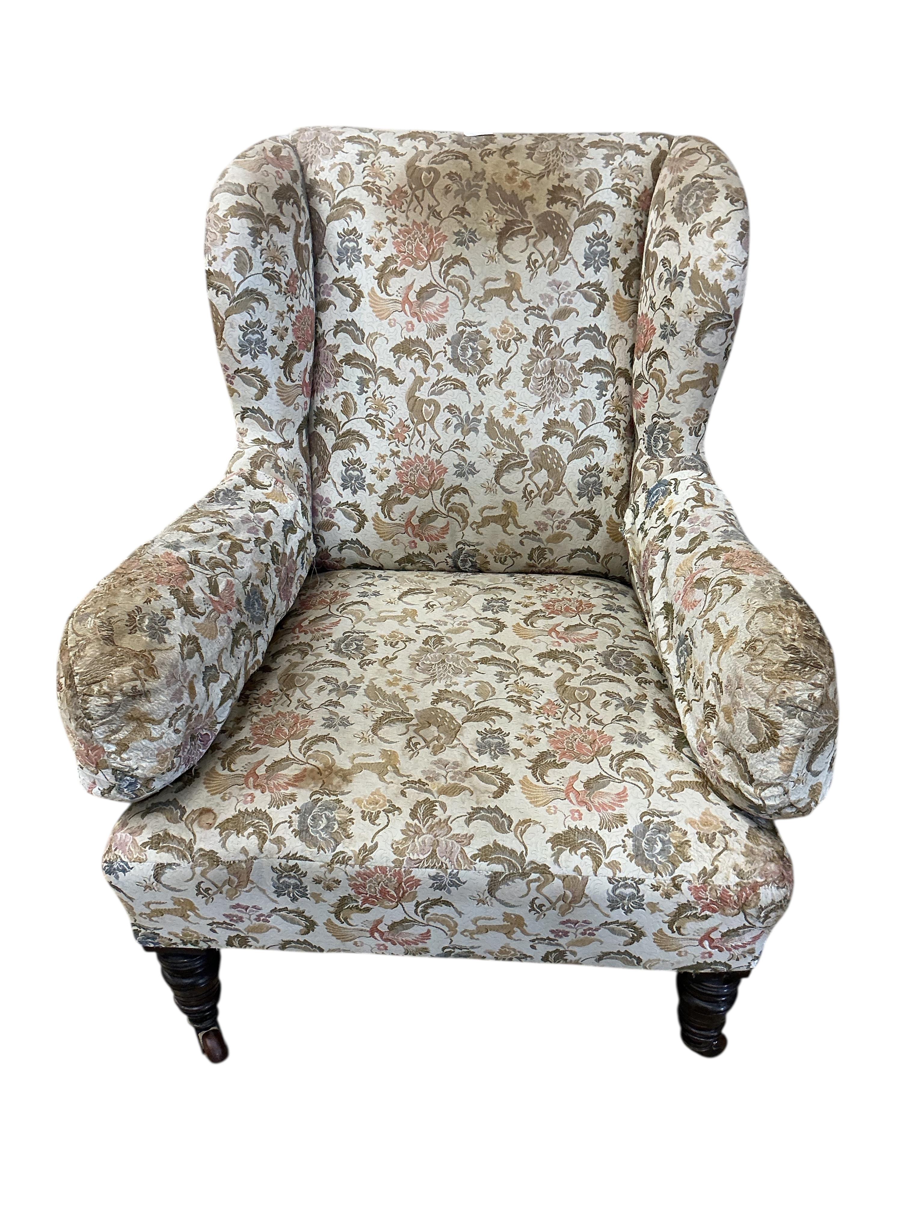 A late Victorian upholstered wing armchair, width 75cm, depth 78cm, height 91cm